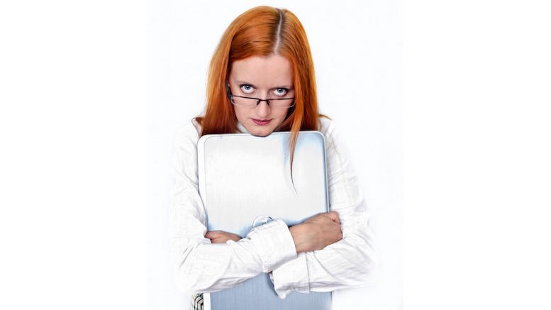woman-office-worker-holds-laptop-stares