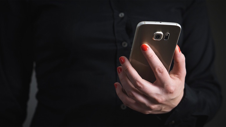 woman-girl-mobile-phone-hand-nails-nail-varnish-red-gloss