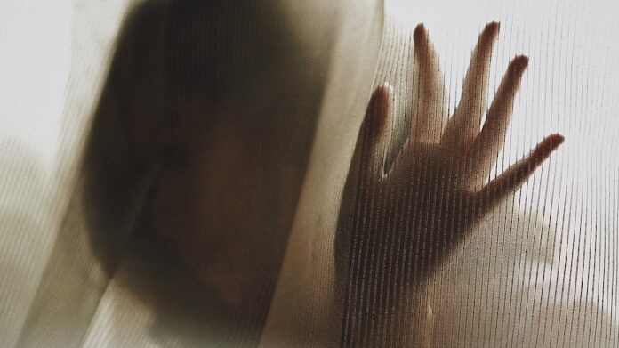 woman-curtain-distress-abuse-sorrow