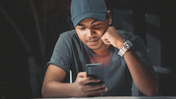 man-reads-messages-notifications-on-mobile-phone