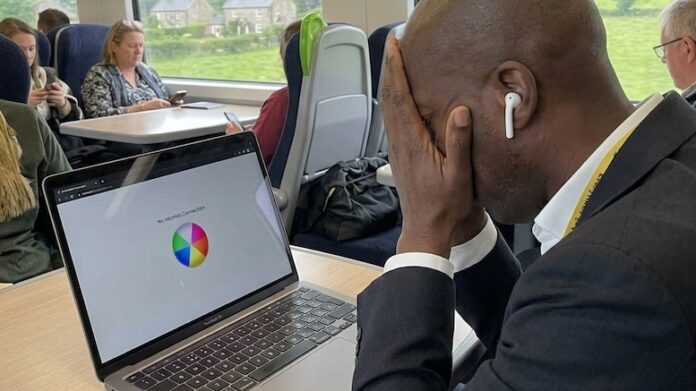 business-man-on-train-frustrated-poor-network-connection